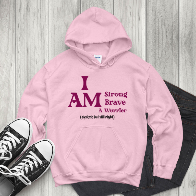 baby pink hoodie with raspberry text saying I am strong brave a worrier, black text dyslexic bust still right